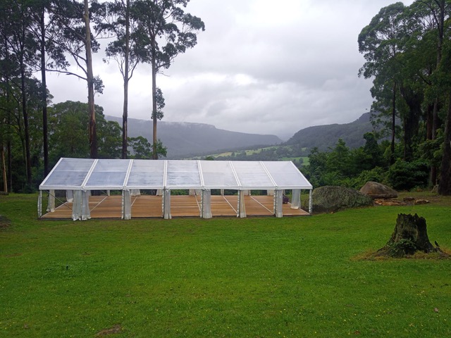 Clear Hocker Marquee on Property with Timber Flooring