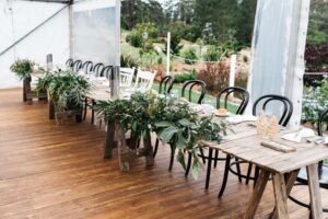 Rustic Timber Tables and Florals with White Bentwood Chairs for Wedding Reception