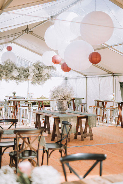 Rustic Timber Tables and Hanging Florals in Clear-Roof Hocker Marquee
