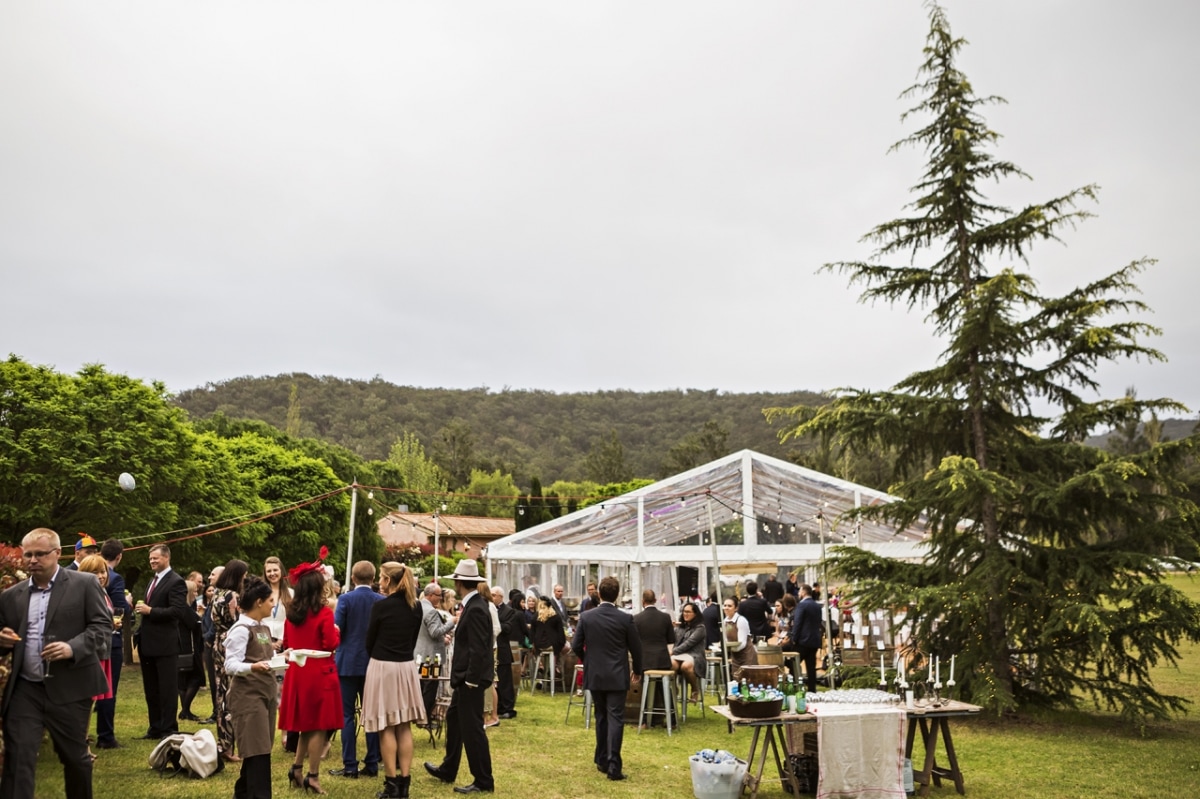 Guests enjoying marquee wedding setup