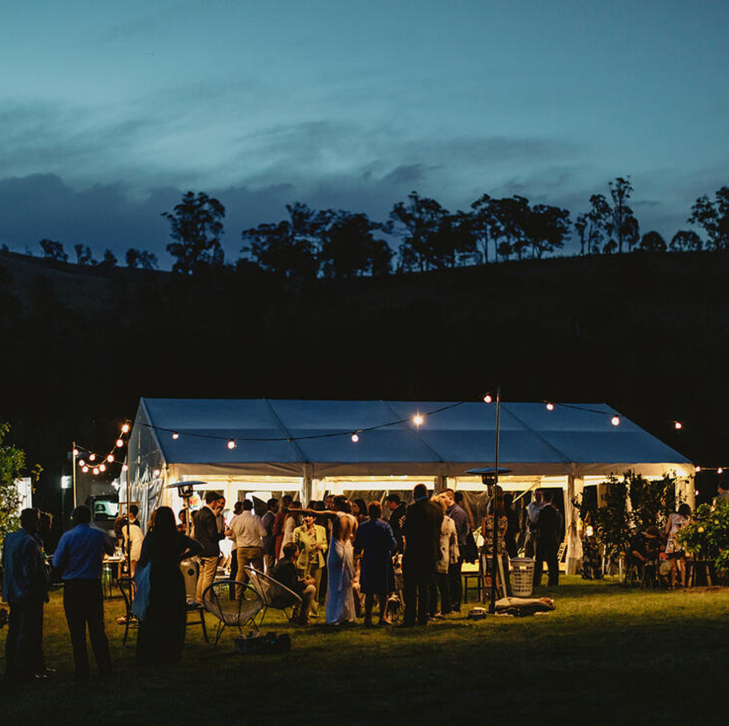 Hocker Marquee with Nighttime Ambiance and Festoon Lighting