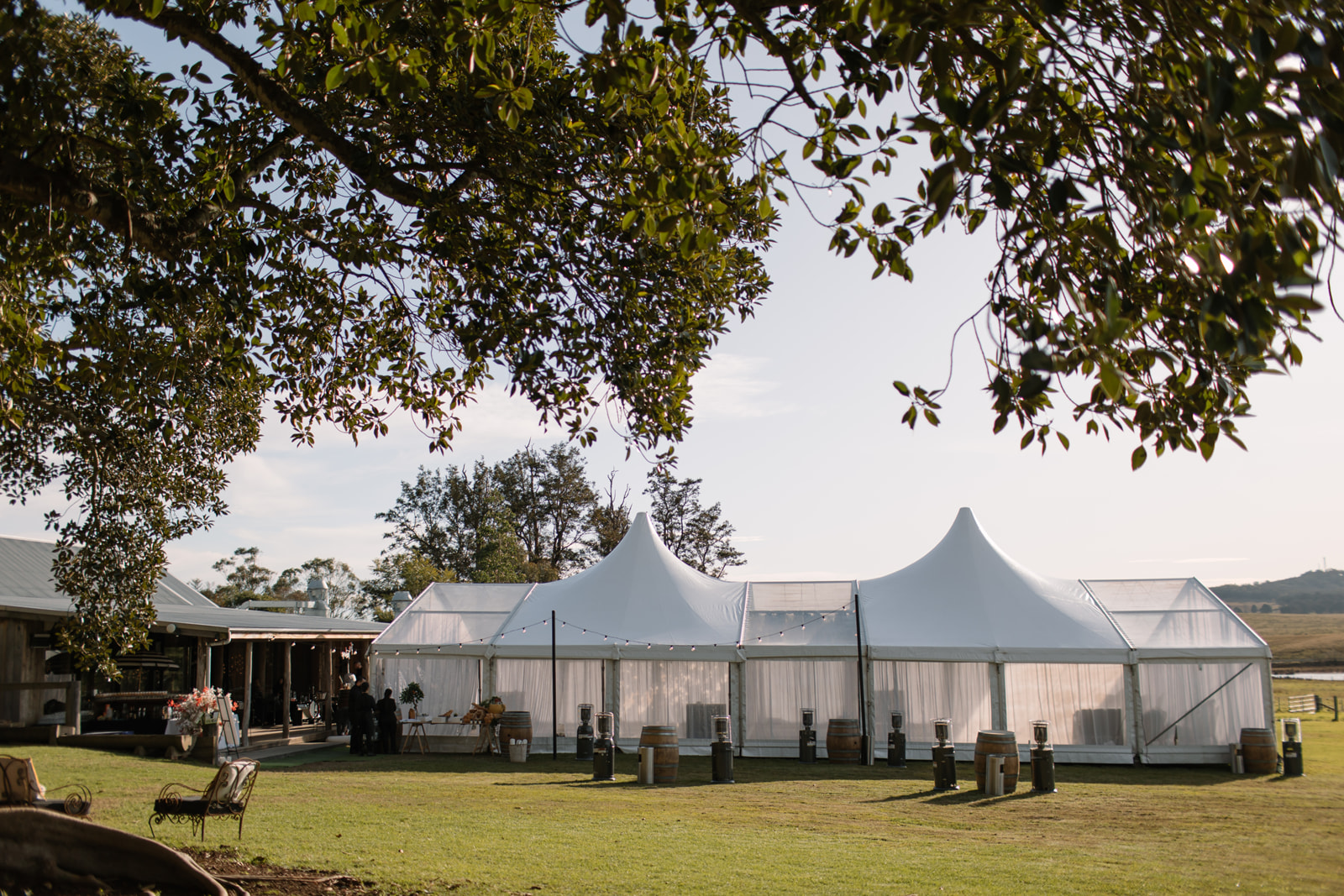 Clear Hocker Peaked Marquee With Festoon Lights for Outdoor Wedding Reception In Day Time