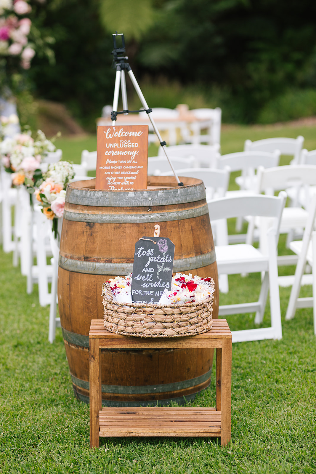 Wine Barrel and Welcome Sign at Wedding Ceremony in Garden