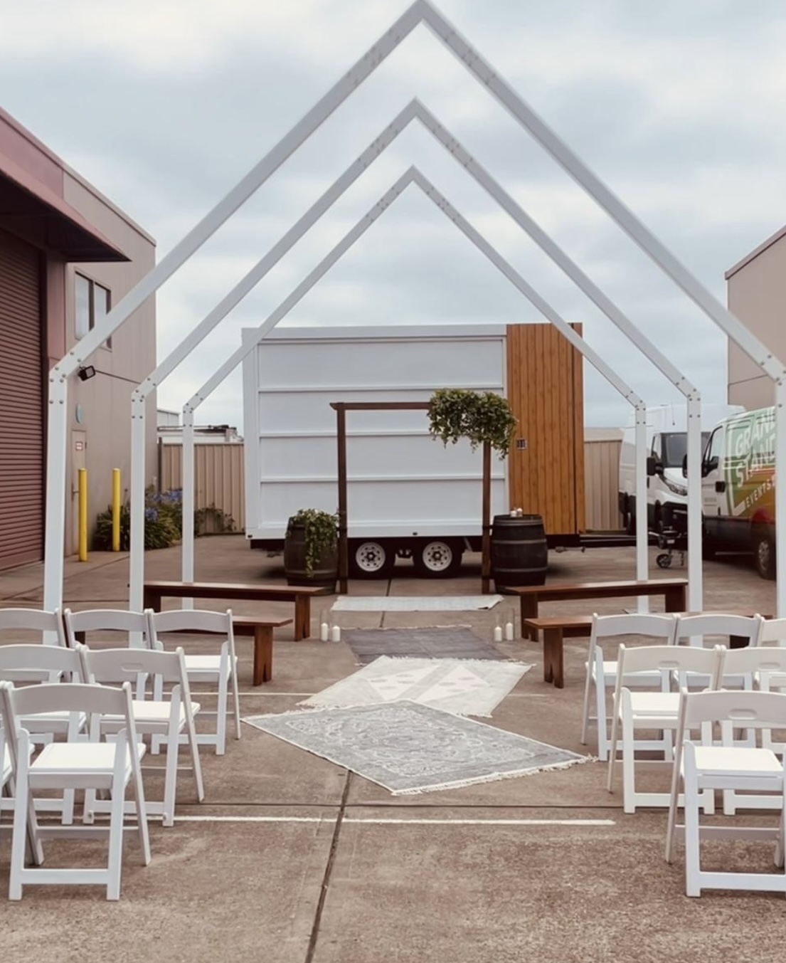 Wedding Ceremony with Arch, Arbour and White Fold Up Chairs