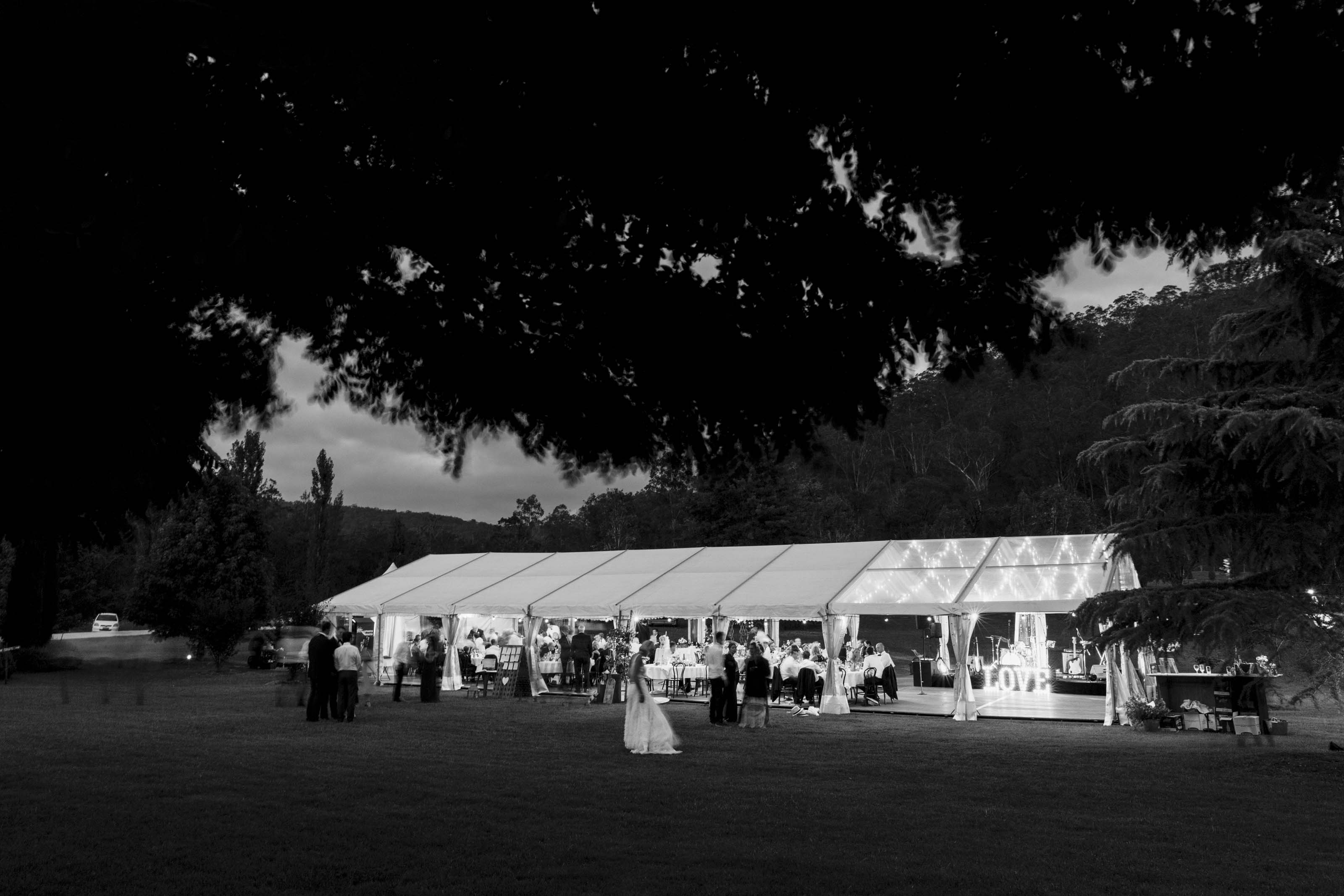 Part Clear Hocker Marquee on Property with Timber Flooring for Wedding