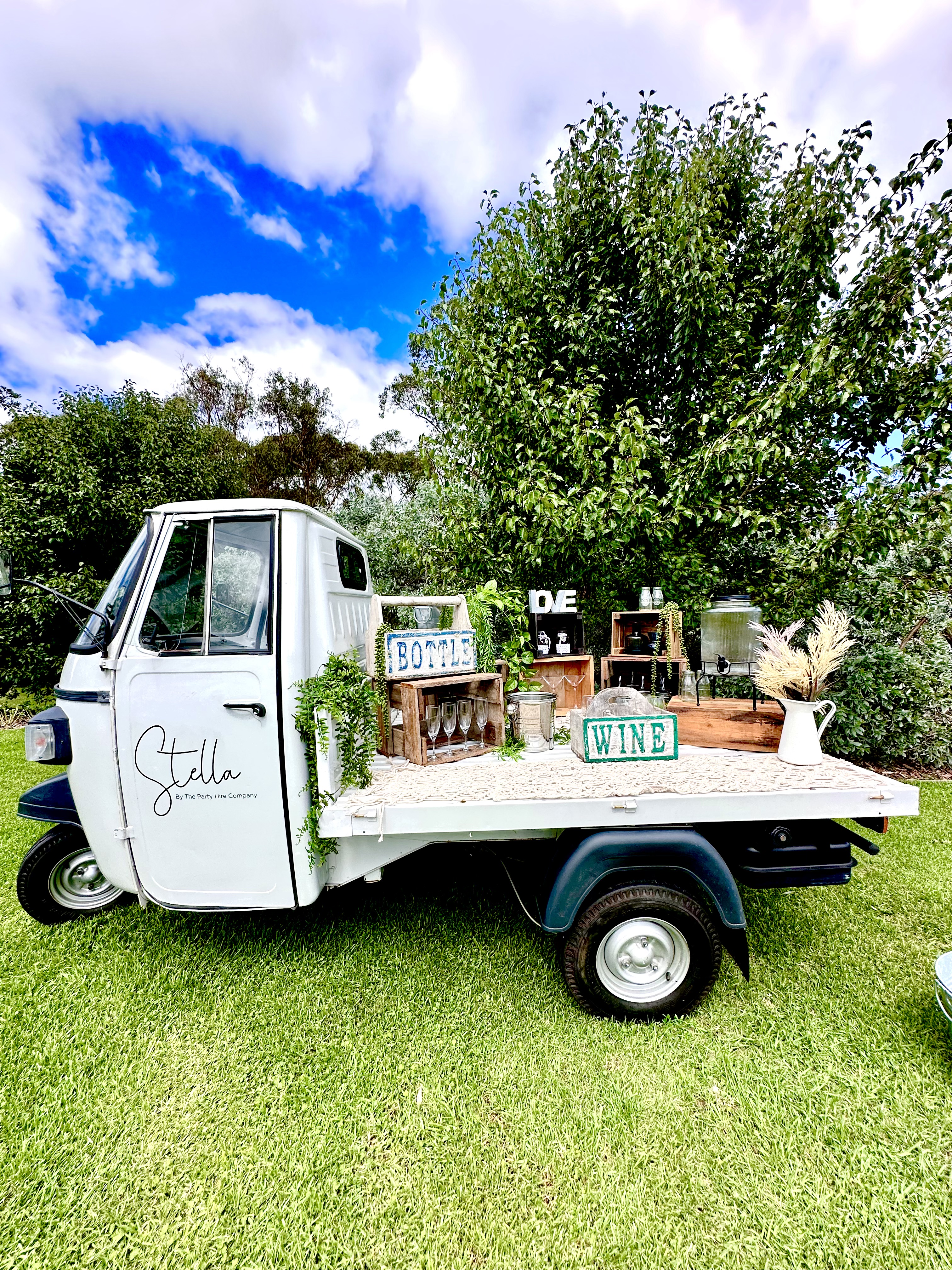 Stella the Piaggio Ape Hospitality Vehicle in Garden Setting