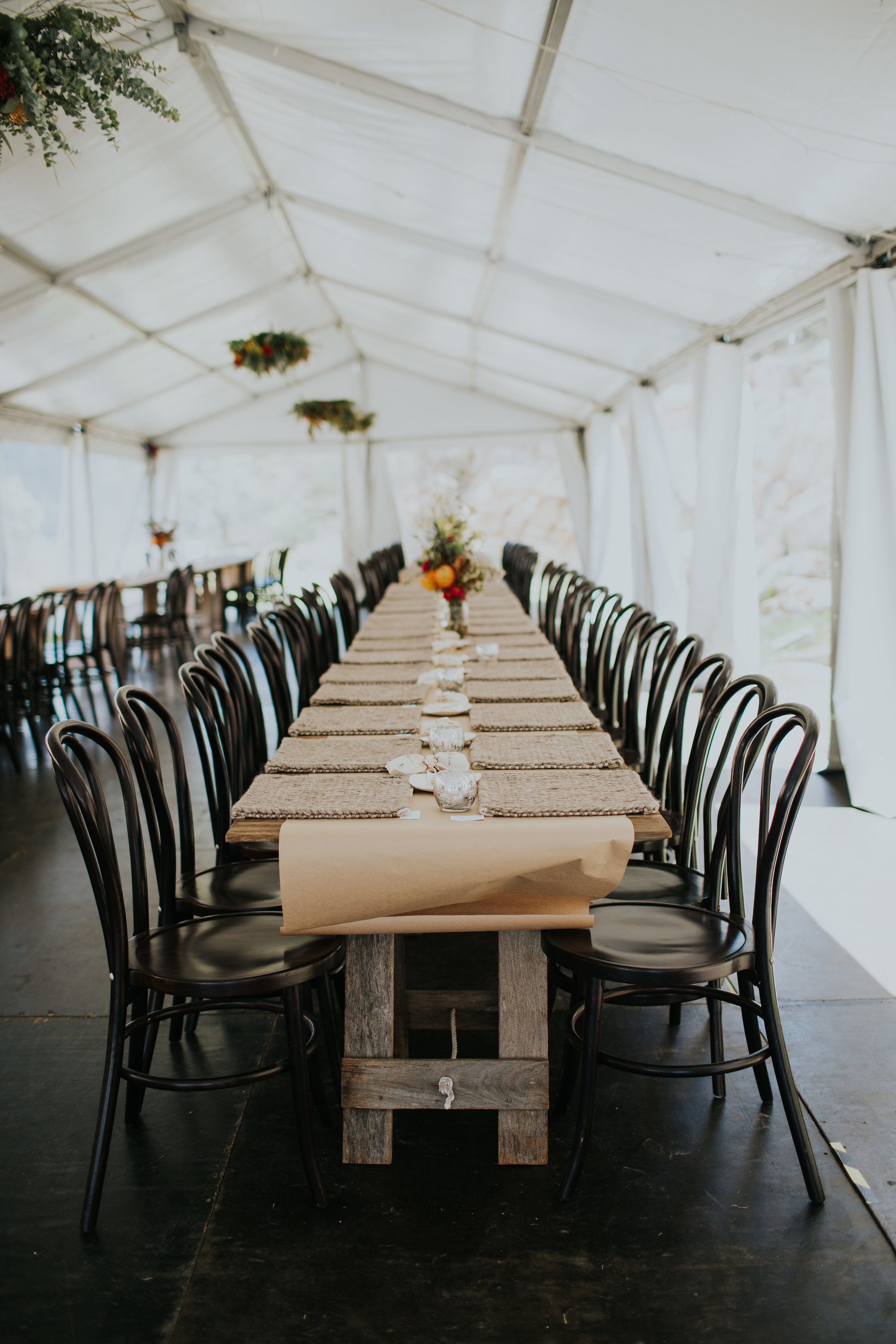Boho Wedding Reception with Timber Chairs, Rustic Table, Neutral Tones and Vibrant Floral Accents under Hocker Marquee