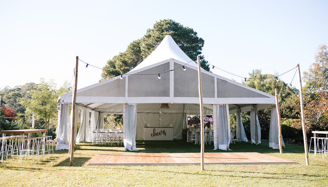 Twin peak marquee wedding setup at Bellbird Gardens